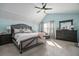 Spacious primary bedroom featuring a tray ceiling, ample natural light, and stylish decor at 4271 Keheley Ne Rd, Marietta, GA 30066