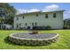 This firepit area is surrounded by lush green grass and a well-maintained yard at 4271 Keheley Ne Rd, Marietta, GA 30066