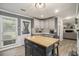 Bright kitchen with a stylish kitchen island, stainless appliances, and white cabinets at 4271 Keheley Ne Rd, Marietta, GA 30066