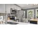 Kitchen boasts stainless steel appliances, modern countertops, and stylish backsplash at 4271 Keheley Ne Rd, Marietta, GA 30066