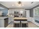 Modern kitchen with stainless steel appliances, gray cabinetry, and a functional center island with seating at 4271 Keheley Ne Rd, Marietta, GA 30066