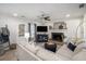 Cozy living room with a brick fireplace, plush seating, and natural light streaming through the windows at 4271 Keheley Ne Rd, Marietta, GA 30066