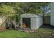 The backyard shed offers convenient storage and is surrounded by greenery at 4271 Keheley Ne Rd, Marietta, GA 30066