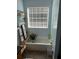 Bathroom area with a tub, large window, and decor at 120 Alfred Dr, Carrollton, GA 30116
