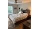 Bedroom features a bed, decorative headboard, and natural light at 120 Alfred Dr, Carrollton, GA 30116