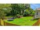 Large fenced-in backyard with mature trees and plenty of room for outdoor activities at 168 Gatlin Ridge Run, Dallas, GA 30157