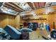 Unfinished basement with exposed ceiling and walls, cluttered with belongings and storage items at 168 Gatlin Ridge Run, Dallas, GA 30157