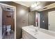 Spacious bathroom with neutral colored tile flooring, and vanity with white countertop at 168 Gatlin Ridge Run, Dallas, GA 30157