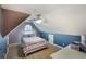 Unique bedroom featuring stylish two-tone walls, carpet flooring, a dormer window, and ample natural light at 168 Gatlin Ridge Run, Dallas, GA 30157