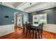 Dining room with wood floors and a modern light fixture with large window at 168 Gatlin Ridge Run, Dallas, GA 30157