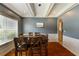 Formal dining room featuring stylish wainscoting and a large window at 168 Gatlin Ridge Run, Dallas, GA 30157