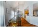 Dining area with hardwood floors, bright chandelier, and open layout at 168 Gatlin Ridge Run, Dallas, GA 30157