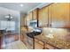 Well-equipped kitchen featuring granite countertops and stainless steel appliances at 168 Gatlin Ridge Run, Dallas, GA 30157