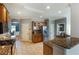Bright kitchen with granite countertops, stainless steel refrigerator, and tile flooring at 168 Gatlin Ridge Run, Dallas, GA 30157