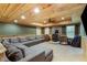 Living room showcases a sectional sofa, wood burning stove, and wooden ceilings at 168 Gatlin Ridge Run, Dallas, GA 30157