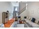 Comfortable living room with hardwood floors, staircase, and views to entry at 168 Gatlin Ridge Run, Dallas, GA 30157
