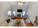 Bright living room boasts high ceilings, hardwood floors, fireplace, and stylish furnishings for a comfortable and inviting atmosphere at 168 Gatlin Ridge Run, Dallas, GA 30157