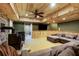 Living room showcases a sectional sofa, wood burning stove, and wooden ceilings at 168 Gatlin Ridge Run, Dallas, GA 30157