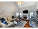 Spacious living room with stone fireplace, vaulted ceiling, and hardwood floors at 168 Gatlin Ridge Run, Dallas, GA 30157