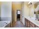 Bright main bathroom with double vanity sinks, soaking tub, and walk-in shower at 168 Gatlin Ridge Run, Dallas, GA 30157
