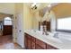 Bright main bathroom with double vanity sinks and a soaking tub at 168 Gatlin Ridge Run, Dallas, GA 30157