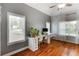 Sunlit room with hardwood floors, vaulted ceilings, and office furniture at 168 Gatlin Ridge Run, Dallas, GA 30157