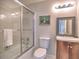 Modern bathroom with glass shower, vanity with dark wood cabinet and great lighting at 1808 Jacksons Creek Dr, Marietta, GA 30068