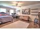 Cozy bedroom featuring a bed, a work area, and stylish decor with natural light at 1808 Jacksons Creek Dr, Marietta, GA 30068