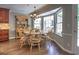 Bright breakfast nook with a bay window and a round wooden table with seating for six at 1808 Jacksons Creek Dr, Marietta, GA 30068
