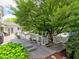 Spacious deck area featuring gray wood, green plants, a grill, and a gazebo in the background at 1808 Jacksons Creek Dr, Marietta, GA 30068