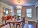Formal dining room with hardwood floors, a chandelier, and ample natural light at 1808 Jacksons Creek Dr, Marietta, GA 30068