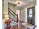 Elegant foyer with decorative front door, staircase, and hardwood floors at 1808 Jacksons Creek Dr, Marietta, GA 30068