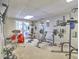 Spacious home gym featuring weight training equipment, a drumset, and access to the backyard at 1808 Jacksons Creek Dr, Marietta, GA 30068
