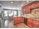 The kitchen features cherry wood cabinets, an island and a breakfast nook with bay windows at 1808 Jacksons Creek Dr, Marietta, GA 30068