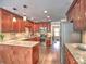 A kitchen featuring wood cabinets, stainless steel appliances, and granite countertops at 1808 Jacksons Creek Dr, Marietta, GA 30068