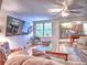 Relaxing living room with a large TV, comfortable seating, and access to a kitchen and game area at 1808 Jacksons Creek Dr, Marietta, GA 30068