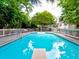 A stunning in-ground pool with crystal clear water, surrounded by a spacious deck and lush green trees at 1808 Jacksons Creek Dr, Marietta, GA 30068