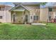 Backyard features a well-manicured lawn and a small patio, ideal for outdoor seating and relaxation at 2165 Capella Cir, South Fulton, GA 30331