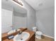 Bathroom features wood cabinets, a white sink, toilet and shower with lots of room at 2165 Capella Cir, South Fulton, GA 30331
