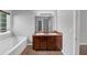 Bathroom with a soaking tub and double vanity at 2165 Capella Cir, South Fulton, GA 30331