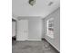 Bedroom with neutral gray walls and carpet, plus a window overlooking the front yard at 2165 Capella Cir, South Fulton, GA 30331