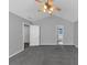 Spacious bedroom features a ceiling fan and neutral carpeting at 2165 Capella Cir, South Fulton, GA 30331