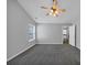 Spacious bedroom features a ceiling fan and neutral carpeting at 2165 Capella Cir, South Fulton, GA 30331