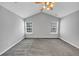 Spacious bedroom features a ceiling fan and neutral carpeting at 2165 Capella Cir, South Fulton, GA 30331