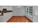 Bright dining room with hardwood floors, a chandelier, and views of the adjacent kitchen at 2165 Capella Cir, South Fulton, GA 30331