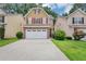 Charming two-story home with a two car garage and well-maintained lawn and an inviting curb appeal at 2165 Capella Cir, South Fulton, GA 30331