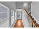 Bright foyer with hardwood floors, staircase, and large windows offering plenty of natural light at 2165 Capella Cir, South Fulton, GA 30331