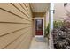 Inviting entryway with a classic front door, elegant sidelight, and meticulously kept landscaping at 2165 Capella Cir, South Fulton, GA 30331