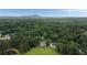 Peaceful wooded neighborhood, with mountain views, lush greenery, and beautiful homes with spacious yards at 4188 Kindlewood Ne Ct, Roswell, GA 30075