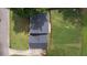 Aerial view showcasing the house, driveway, roof, and manicured backyard at 4188 Kindlewood Ne Ct, Roswell, GA 30075